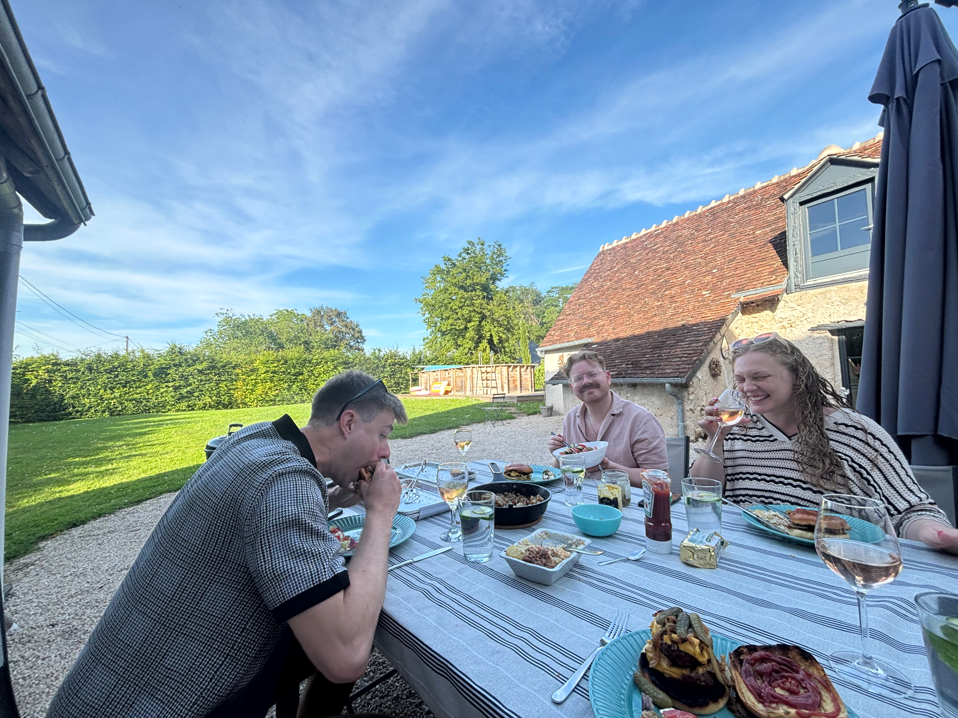 The team sharing a meal outdoors